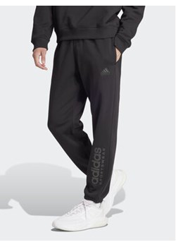 adidas Spodnie dresowe ALL SZN Fleece Graphic IW1201 Czarny Regular Fit ze sklepu MODIVO w kategorii Spodnie męskie - zdjęcie 171343920