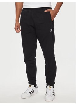 adidas Spodnie dresowe Trefoil Essentials IR7798 Czarny Slim Fit ze sklepu MODIVO w kategorii Spodnie męskie - zdjęcie 171344254