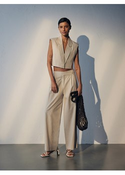 Reserved - Spodnie z asymetrycznym zapięciem z lnem - beżowy ze sklepu Reserved w kategorii Spodnie damskie - zdjęcie 171355914