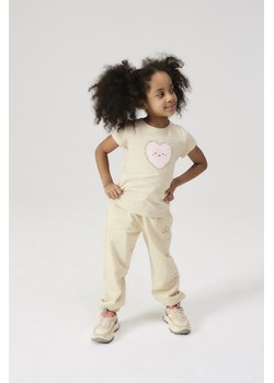 Spodnie dresowe dla dziewczynki - beżowe z pieskiem - 5.10.15. ze sklepu 5.10.15 w kategorii Spodnie dziewczęce - zdjęcie 171423280