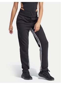 adidas Spodnie dresowe Dance All-Gender IN1830 Czarny Regular Fit ze sklepu MODIVO w kategorii Spodnie damskie - zdjęcie 171454402