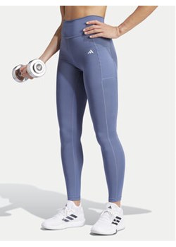 adidas Legginsy Optime IT9110 Niebieski Slim Fit ze sklepu MODIVO w kategorii Spodnie damskie - zdjęcie 171540491