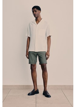 H & M - Spodnie z bawełnianego diagonalu Slim Fit - Zielony ze sklepu H&M w kategorii Spodenki męskie - zdjęcie 171953192
