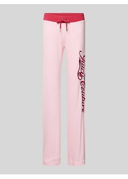 Spodnie dresowe o rozkloszowanym kroju z wyhaftowanym logo model ‘LISA’ ze sklepu Peek&Cloppenburg  w kategorii Spodnie damskie - zdjęcie 172057071