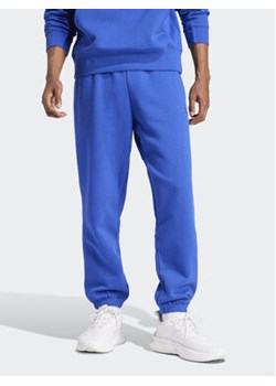 adidas Spodnie dresowe ALL SZN IW1186 Niebieski Regular Fit ze sklepu MODIVO w kategorii Spodnie męskie - zdjęcie 172104513