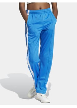 adidas Spodnie dresowe Adibreak IP0615 Niebieski Regular Fit ze sklepu MODIVO w kategorii Spodnie damskie - zdjęcie 172104772