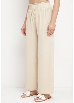 Jasnobeżowe Szerokie Spodnie z Gumką w Pasie Fiameta ze sklepu Born2be Odzież w kategorii Spodnie damskie - zdjęcie 172130532