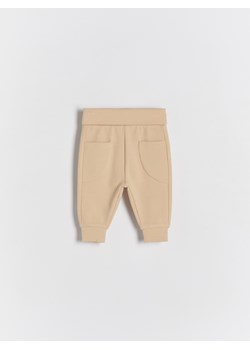 Reserved - Dzianinowe spodnie z kieszeniami - beżowy ze sklepu Reserved w kategorii Spodnie i półśpiochy - zdjęcie 172161220