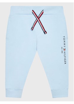 Tommy Hilfiger Spodnie dresowe Essential KN0KN01281 Błękitny Regular Fit ze sklepu MODIVO w kategorii Spodnie i półśpiochy - zdjęcie 172166533