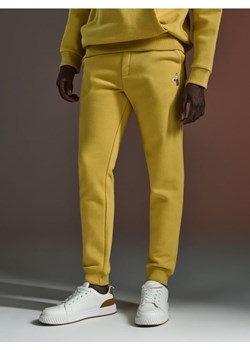Sinsay - Spodnie dresowe jogger - żółty ze sklepu Sinsay w kategorii Spodnie męskie - zdjęcie 172176761