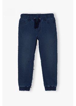 Spodnie chłopięce jeansowe - granatowy ze sklepu 5.10.15 w kategorii Spodnie chłopięce - zdjęcie 172195670