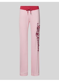 Spodnie dresowe o rozkloszowanym kroju z wyhaftowanym logo model ‘LISA’ ze sklepu Peek&Cloppenburg  w kategorii Spodnie damskie - zdjęcie 172238374