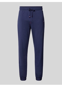 Spodnie dresowe w jednolitym kolorze ze sklepu Peek&Cloppenburg  w kategorii Spodnie męskie - zdjęcie 172238921