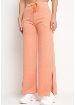 Pomarańczowe Szerokie Spodnie z Gumką w Pasie i Rozcięciami Jacilla ze sklepu Born2be Odzież w kategorii Spodnie damskie - zdjęcie 172246154
