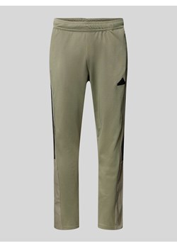 Spodnie treningowe o kroju regular fit z kieszeniami zapinanymi na zatrzaski model ‘TIRO’ ze sklepu Peek&Cloppenburg  w kategorii Spodnie męskie - zdjęcie 172250221