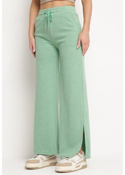 Zielone Szerokie Spodnie z Gumką w Pasie i Rozcięciami Jacilla ze sklepu Born2be Odzież w kategorii Spodnie damskie - zdjęcie 172275281
