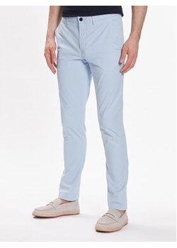 Tommy Hilfiger Chinosy Bleecker 1985 MW0MW26619 Błękitny Slim Fit ze sklepu MODIVO w kategorii Spodnie męskie - zdjęcie 172288452