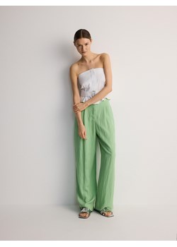 Reserved - Spodnie z lyocellem - jasnozielony ze sklepu Reserved w kategorii Spodnie damskie - zdjęcie 172303541