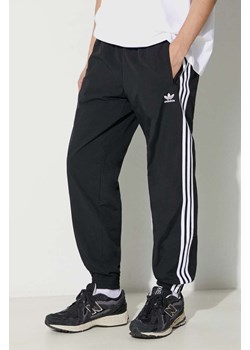 adidas Originals spodnie Adicolor Woven Firebird Track Top męskie kolor czarny wzorzyste IT2501 ze sklepu PRM w kategorii Spodnie męskie - zdjęcie 172333211