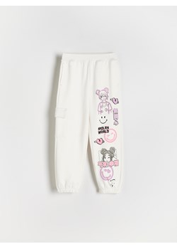 Reserved - Spodnie dresowe SmileyWorld® - złamana biel ze sklepu Reserved w kategorii Spodnie dziewczęce - zdjęcie 172353150