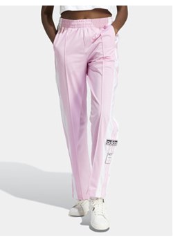 adidas Spodnie dresowe Adibreak IP0618 Różowy Regular Fit ze sklepu MODIVO w kategorii Spodnie damskie - zdjęcie 172370574