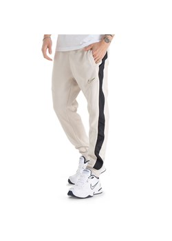Spodnie Nike Sportswear Fleece FN0246-104 - beżowe ze sklepu streetstyle24.pl w kategorii Spodnie męskie - zdjęcie 172373343