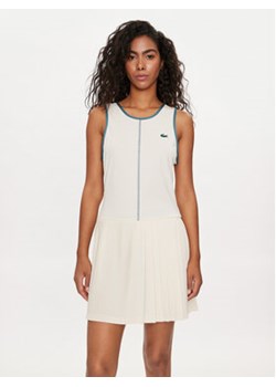 Lacoste Sukienka tenisowa EF7451 Beżowy Slim Fit ze sklepu MODIVO w kategorii Sukienki - zdjęcie 172374934