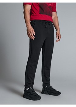 Sinsay - Spodnie dresowe - czarny ze sklepu Sinsay w kategorii Spodnie męskie - zdjęcie 172437974
