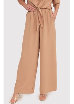 Beżowe spodnie z szerokimi nogawkami i elastyczną talią TRA038, Kolor beżowy, Rozmiar L, AX Paris ze sklepu Primodo w kategorii Spodnie damskie - zdjęcie 172548773