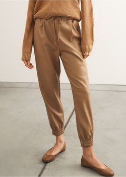Beżowe spodnie z imitacji skóry ze sklepu OCHNIK w kategorii Spodnie damskie - zdjęcie 172552770