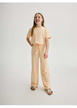 Reserved - Bawełniane spodnie - jasnopomarańczowy ze sklepu Reserved w kategorii Spodnie dziewczęce - zdjęcie 172592150