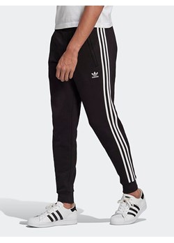 adidas Spodnie dresowe w kolorze czarnym ze sklepu Limango Polska w kategorii Spodnie męskie - zdjęcie 172595812