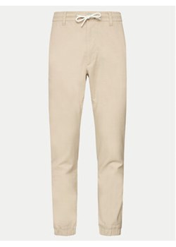 s.Oliver Spodnie materiałowe 2143826 Beżowy Slim Fit ze sklepu MODIVO w kategorii Spodnie męskie - zdjęcie 172618681