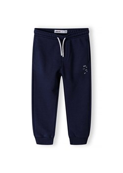 Granatowe dresowe spodnie regular dla chłopca ze sklepu 5.10.15 w kategorii Spodnie chłopięce - zdjęcie 173013334