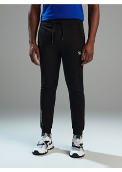 Sinsay - Spodnie dresowe SNSY PERFORMANCE - czarny ze sklepu Sinsay w kategorii Spodnie męskie - zdjęcie 173132342