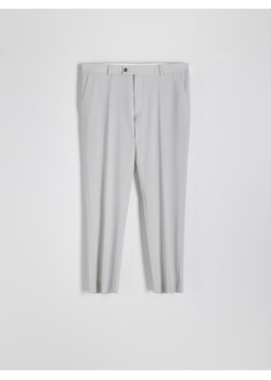 Reserved - Spodnie garniturowe slim z wełną - beżowy ze sklepu Reserved w kategorii Spodnie męskie - zdjęcie 173297530