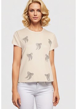 Beżowy T-shirt z Bawełny z Kokardkami Ozdobionymi Cyrkoniami Rissamore ze sklepu Born2be Odzież w kategorii Bluzki damskie - zdjęcie 173370922