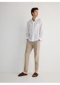 Reserved - Spodnie slim fit - beżowy ze sklepu Reserved w kategorii Spodnie męskie - zdjęcie 173380933