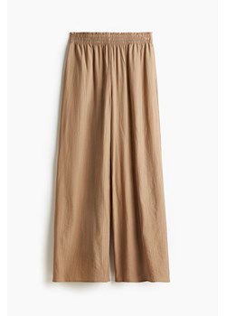 H & M - Szerokie kreszowane spodnie - Beżowy ze sklepu H&M w kategorii Spodnie damskie - zdjęcie 173514374