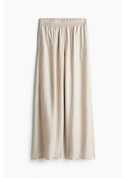 H & M - Szerokie kreszowane spodnie - Beżowy ze sklepu H&M w kategorii Spodnie damskie - zdjęcie 173514400