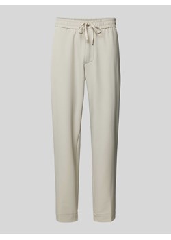 Spodnie o kroju tapered fit z tunelem ze sklepu Peek&Cloppenburg  w kategorii Spodnie męskie - zdjęcie 173555770
