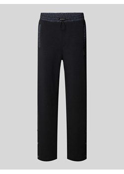 Spodnie dresowe o kroju regular fit z tunelem model ‘Dayquario’ ze sklepu Peek&Cloppenburg  w kategorii Spodnie męskie - zdjęcie 173611462