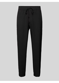 Spodnie o kroju tapered fit z tunelem ze sklepu Peek&Cloppenburg  w kategorii Spodnie męskie - zdjęcie 173629074