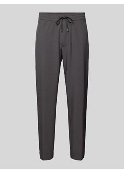 Spodnie o kroju tapered fit z tunelem ze sklepu Peek&Cloppenburg  w kategorii Spodnie męskie - zdjęcie 173629140