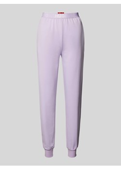 Spodnie dresowe o kroju slim fit z wyhaftowanym logo model ‘SPORTY’ ze sklepu Peek&Cloppenburg  w kategorii Spodnie damskie - zdjęcie 173629472
