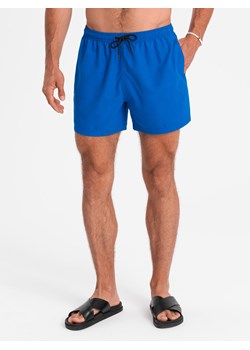 Neonowe męskie szorty kąpielowe z efektem magic print – niebieskie V3 OM-SRBS-0147 ze sklepu ombre w kategorii Kąpielówki - zdjęcie 173639322
