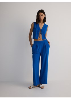 Reserved - Gładkie spodnie - niebieski ze sklepu Reserved w kategorii Spodnie damskie - zdjęcie 173694104