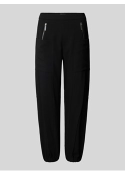 Spodnie materiałowe o kroju tapered fit z elastycznym pasem model ‘Nagano’ ze sklepu Peek&Cloppenburg  w kategorii Spodnie damskie - zdjęcie 173780503