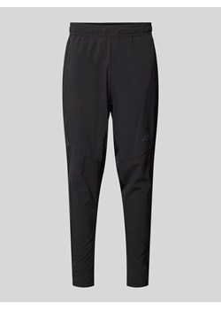 Spodnie dresowe o kroju tapered fit z kieszeniami zapinanymi na zamek błyskawiczny ze sklepu Peek&Cloppenburg  w kategorii Spodnie męskie - zdjęcie 173872384