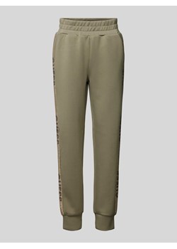 Spodnie dresowe o kroju slim fit z nadrukami z logo ze sklepu Peek&Cloppenburg  w kategorii Spodnie damskie - zdjęcie 173887883